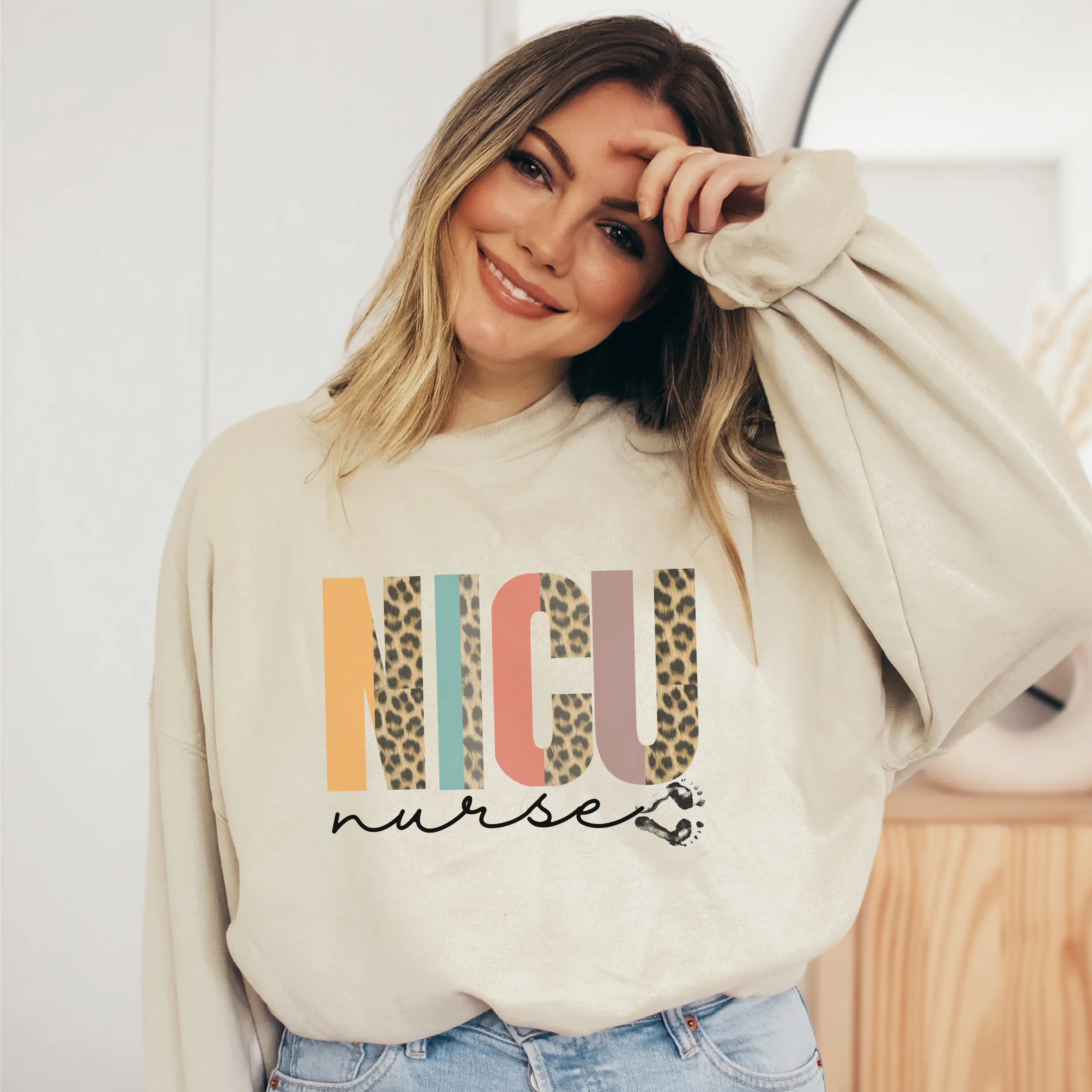Women's NICU Nurse Crewneck Sweatshirt Winter Neonatal ICU on a Soft, Cozy Pullover Unisex-Size Sweatshirt in White, Sand, or Ash